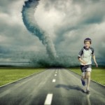 Child running away from a tornado